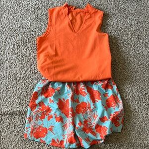 Vibrant Orange Top with Floral Print Shorts